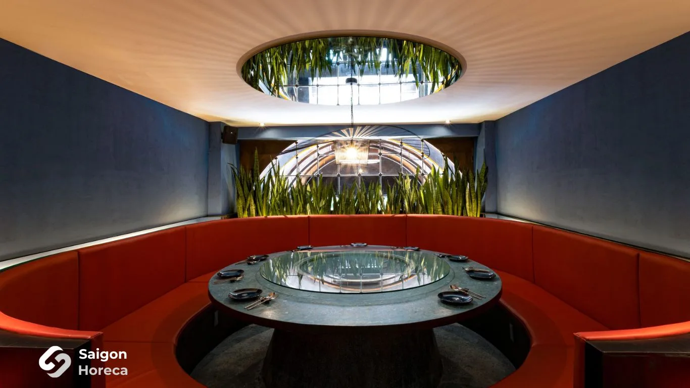 Round-table VIP dining suite illuminated by natural skylight at Amdang Typhoon