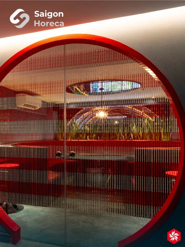 Red-trimmed circular doorway adorned with beaded curtains leading into the Amdang Typhoon VIP suite