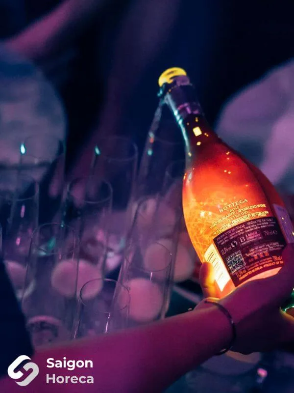 Luminous Bottega sparkling wine bottle served alongside crystal flute glassware at Bling Bling Club