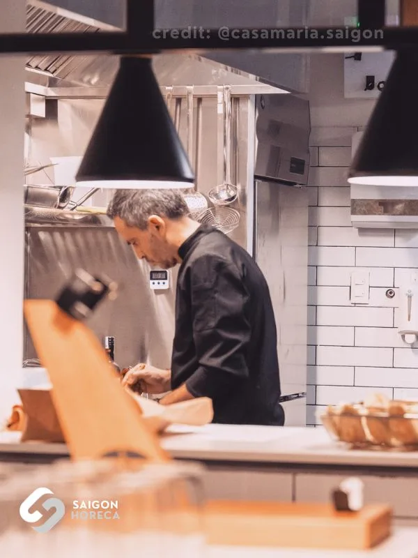 Chef operating within Casa Maria’s primary commercial kitchen line