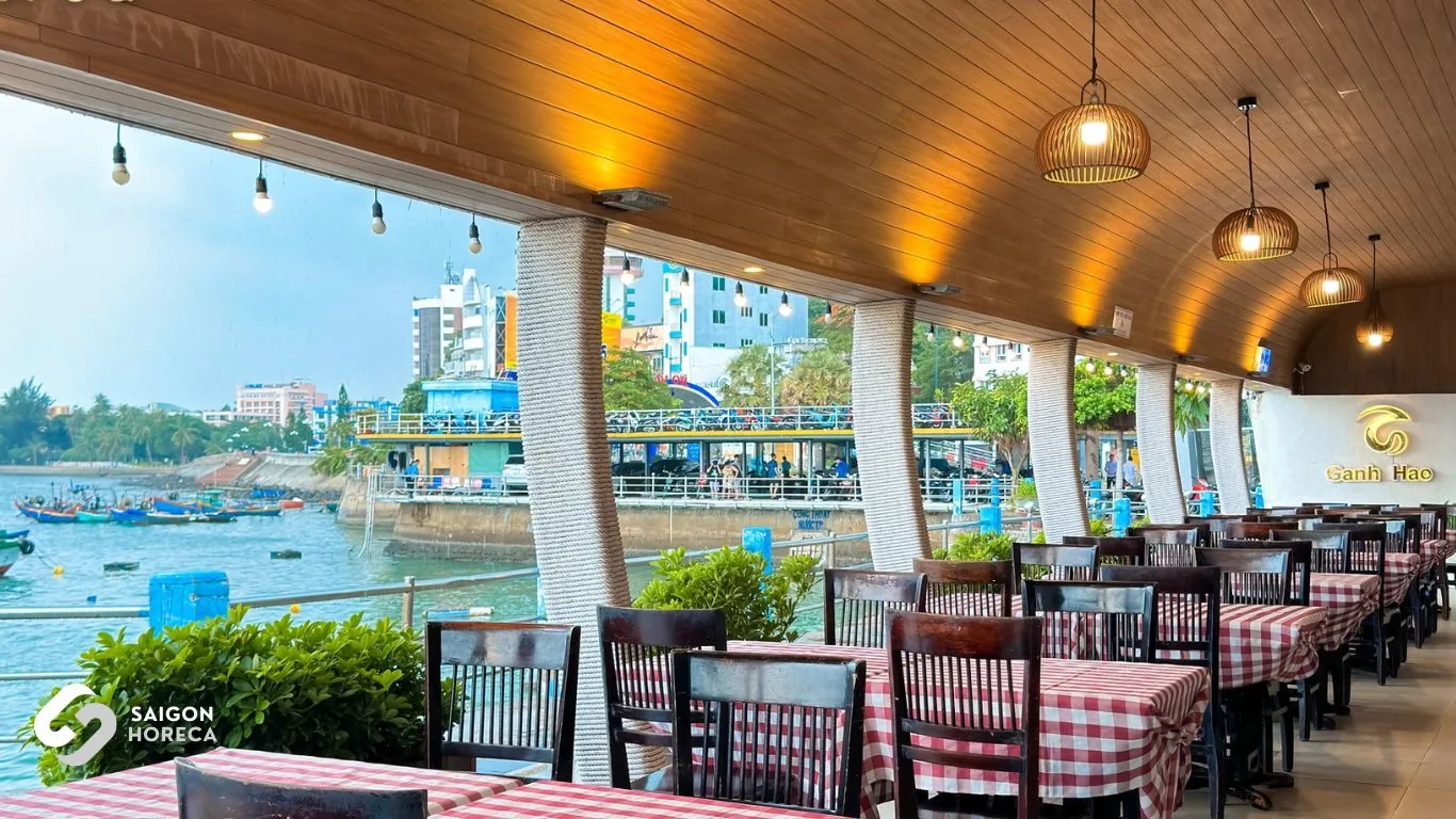 Open-air alfresco dining terrace overlooking the boat marina