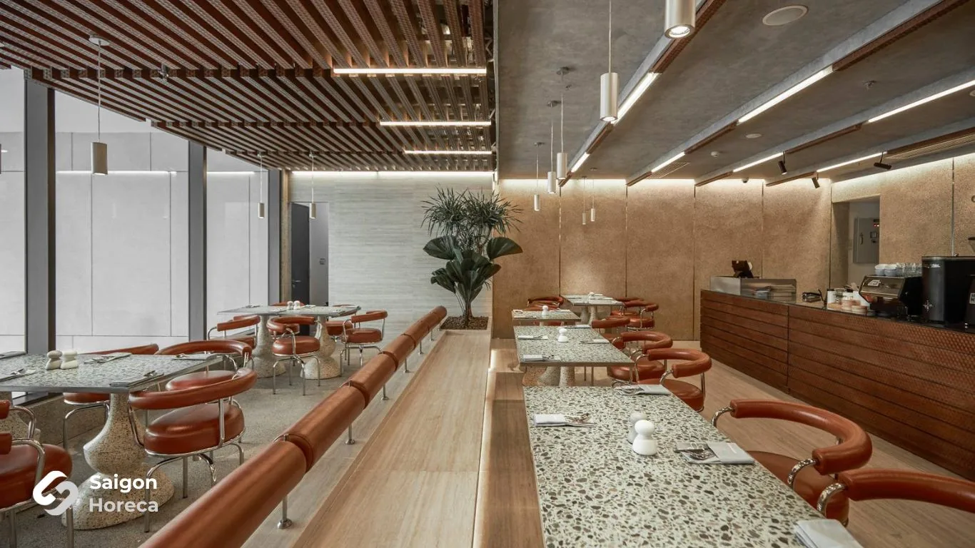 Actual dining room completed with cast terrazzo tables and brown leather seating at GodMother Friendship