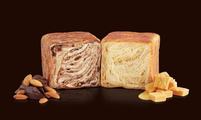 Two halved Grand Marble loaves featuring decadent chocolate-almond and sweet caramel swirls