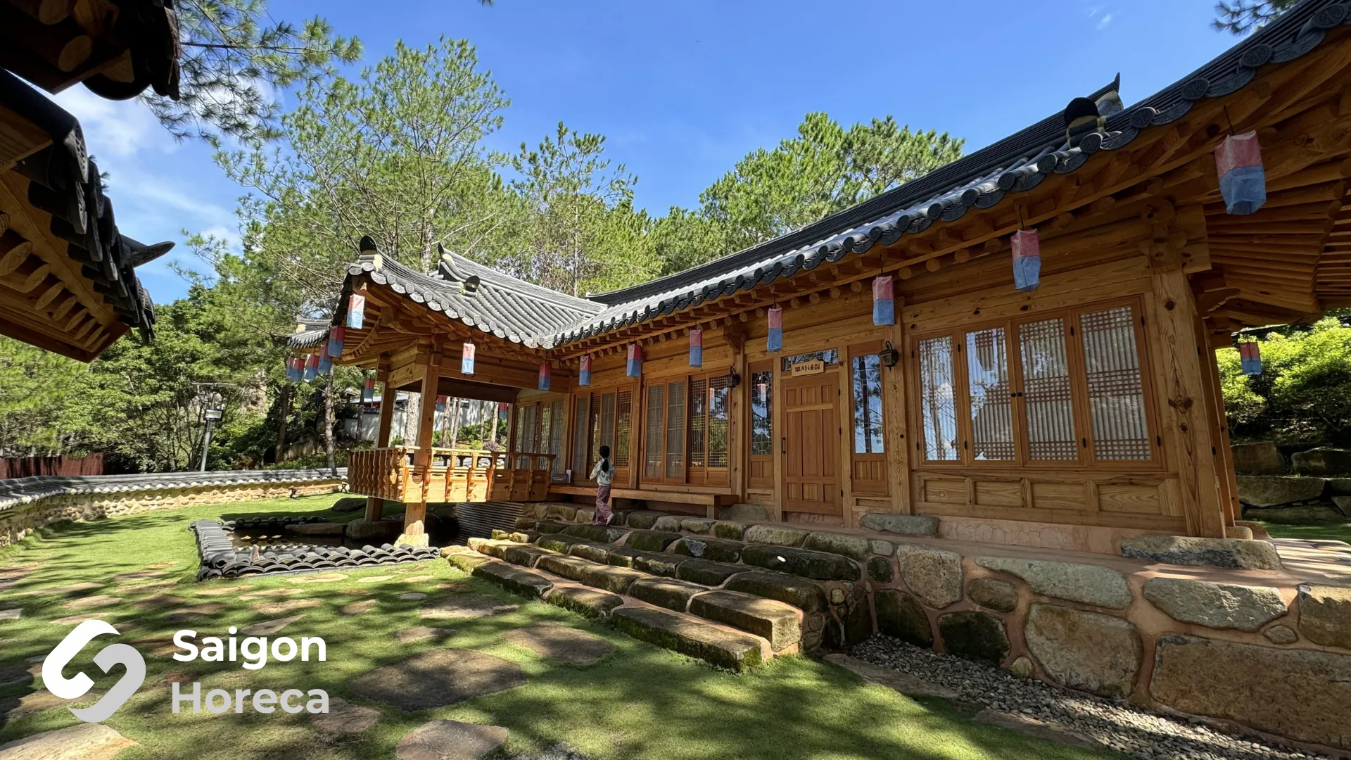 Timber pavilion with traditional tiled roofing nestled in the Elephant Mountain pine canopy