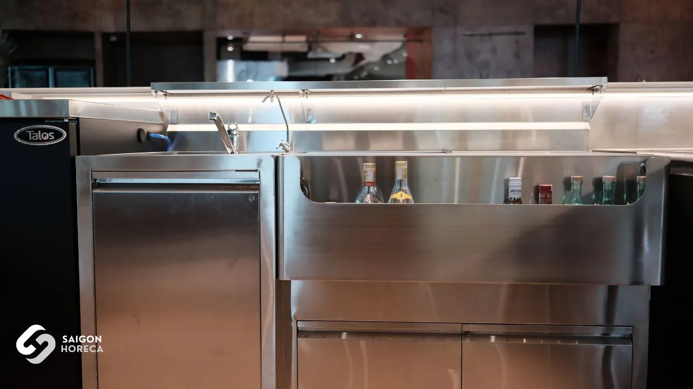 Mam Mam stainless steel bar station equipped with speed rail bottle troughs, mixer tap sink, and Talos under-counter beer & beverage cooler