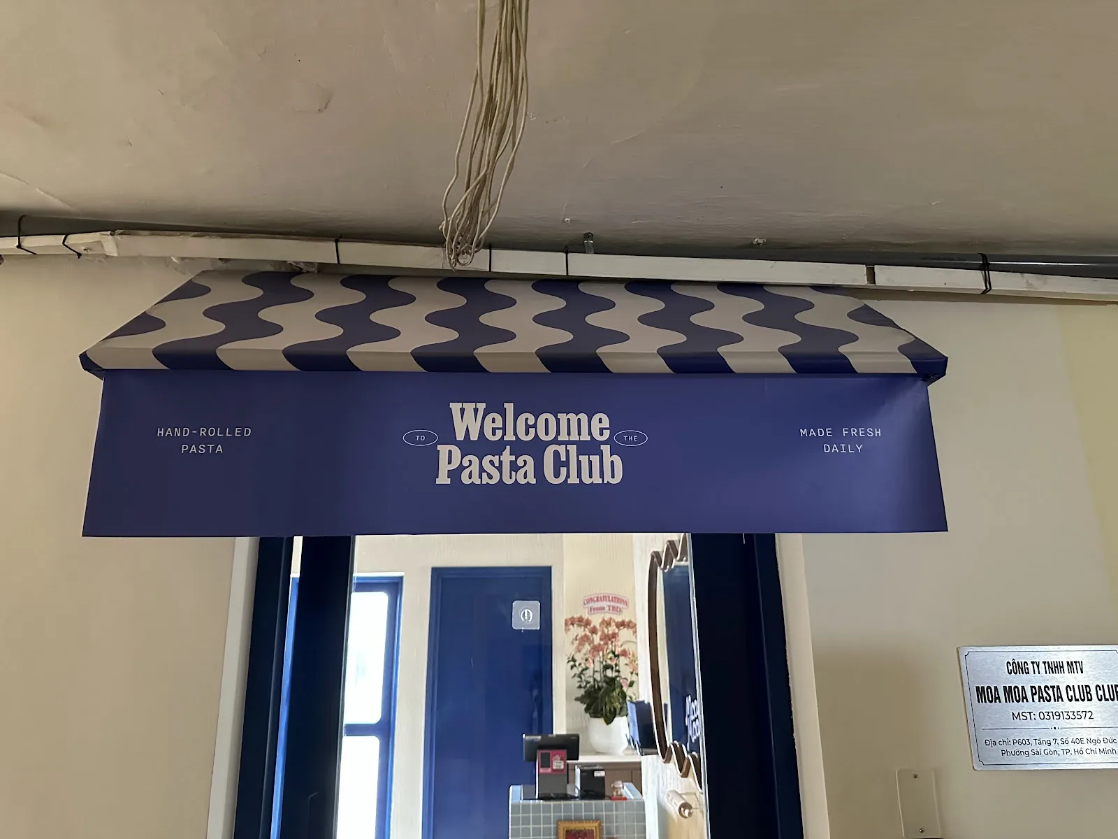 Entrance to Moa Moa Pasta Club showcasing signature brand signage