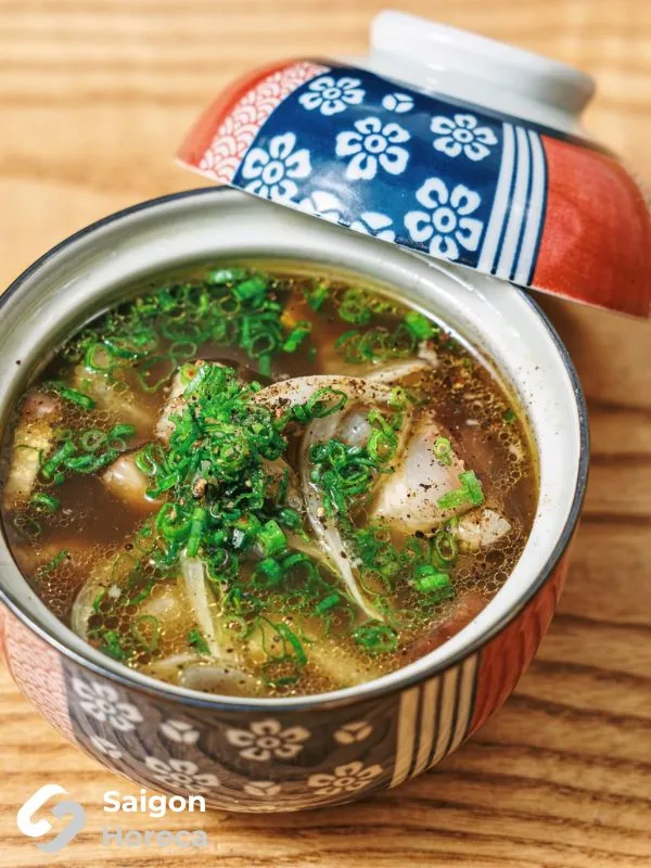 Traditional Japanese soup in a lidded ceramic bowl at Mùa Craft Sake
