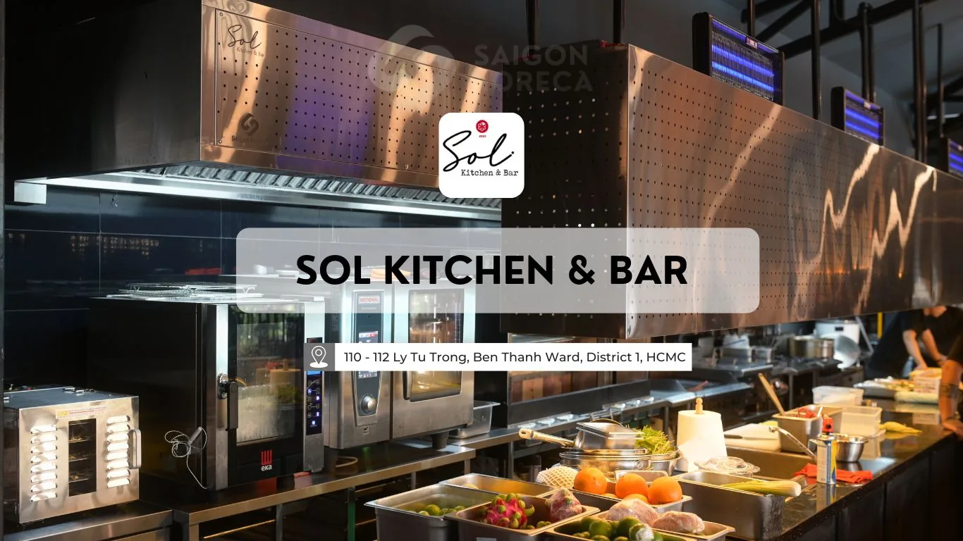 Completed open stainless steel kitchen featuring logo-engraved exhaust hood, RATIONAL combi oven, EKA convection oven, and GN pan fresh ingredient rails.