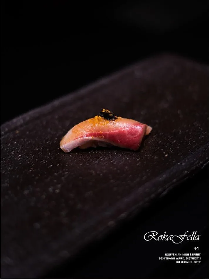 Lightly torched Hamachi yellowtail nigiri topped with black caviar at Roka Fella.