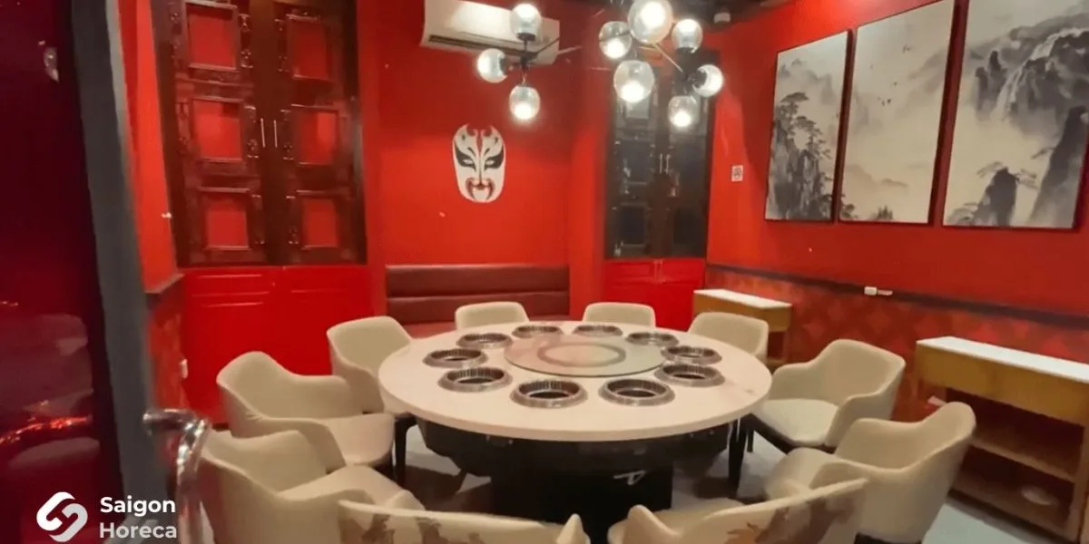 VIP private room featuring round banquet hotpot tables with integrated induction hobs