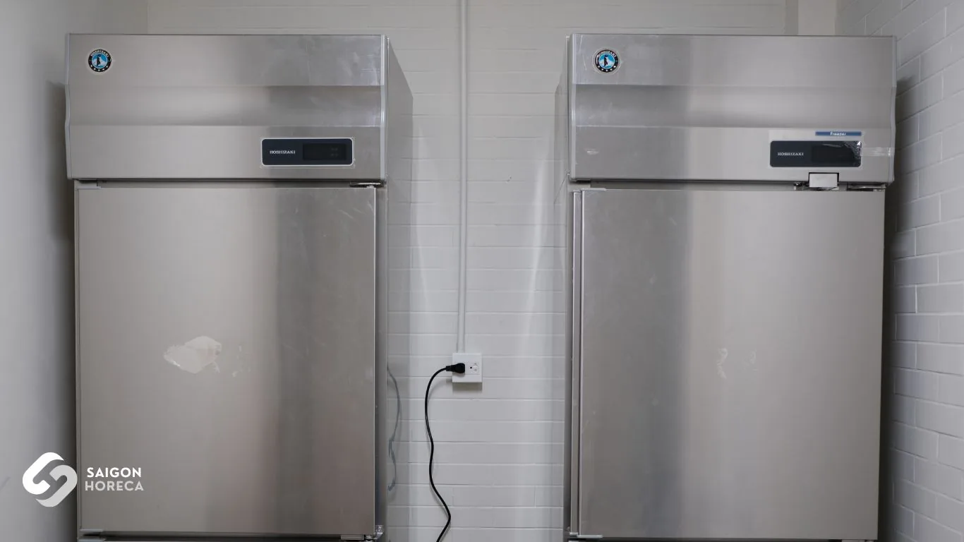 Matched pair of Hoshizaki commercial stainless steel upright freezer and refrigerator at Nam An kitchen