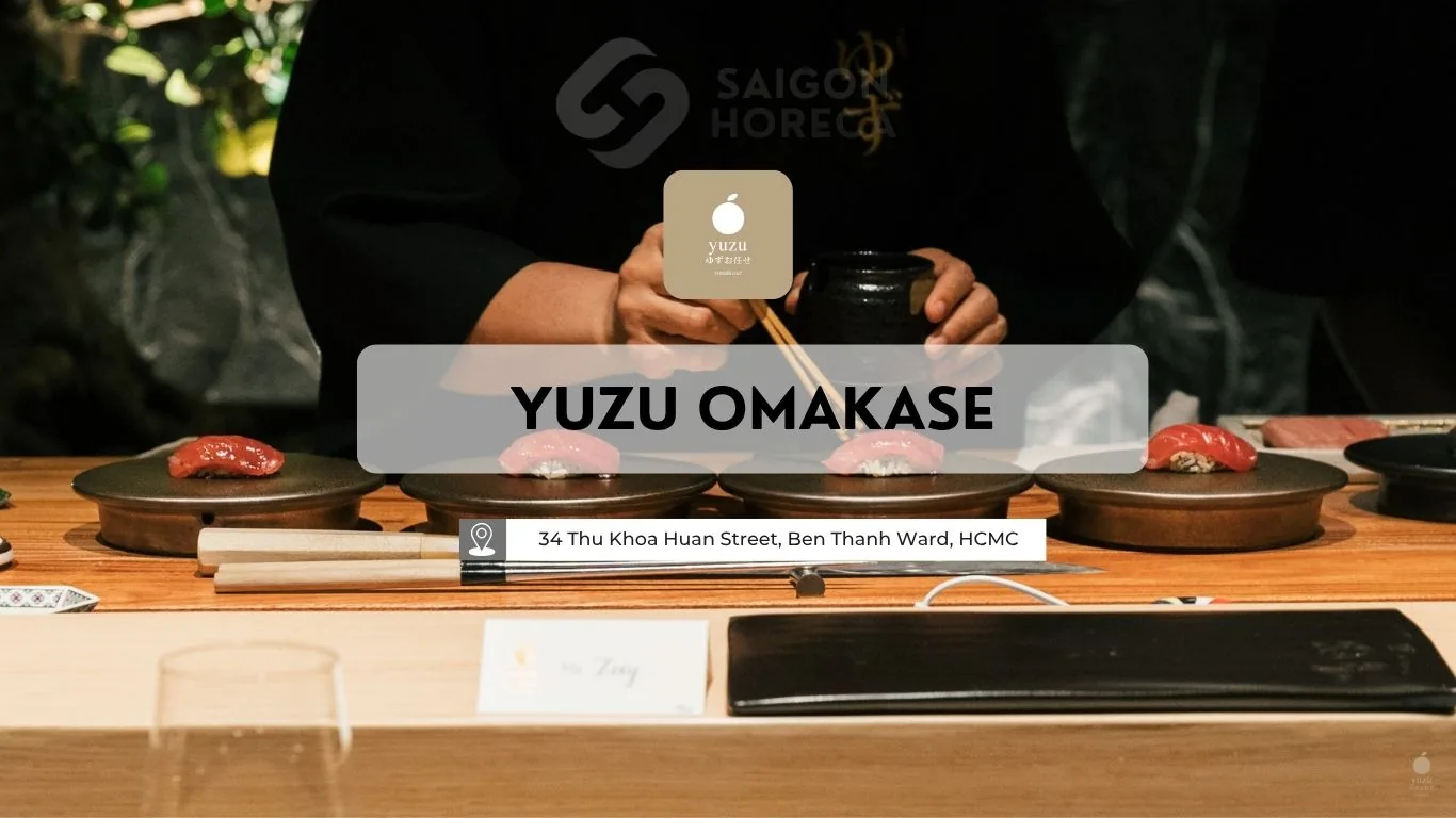 Sushi artisan performing handcrafted nigiri assembly at Yuzu Omakase's open counter